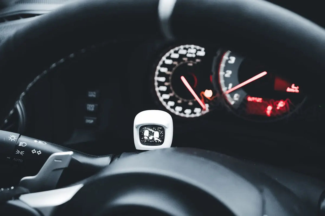 a close up of a steering wheel and a speedometer