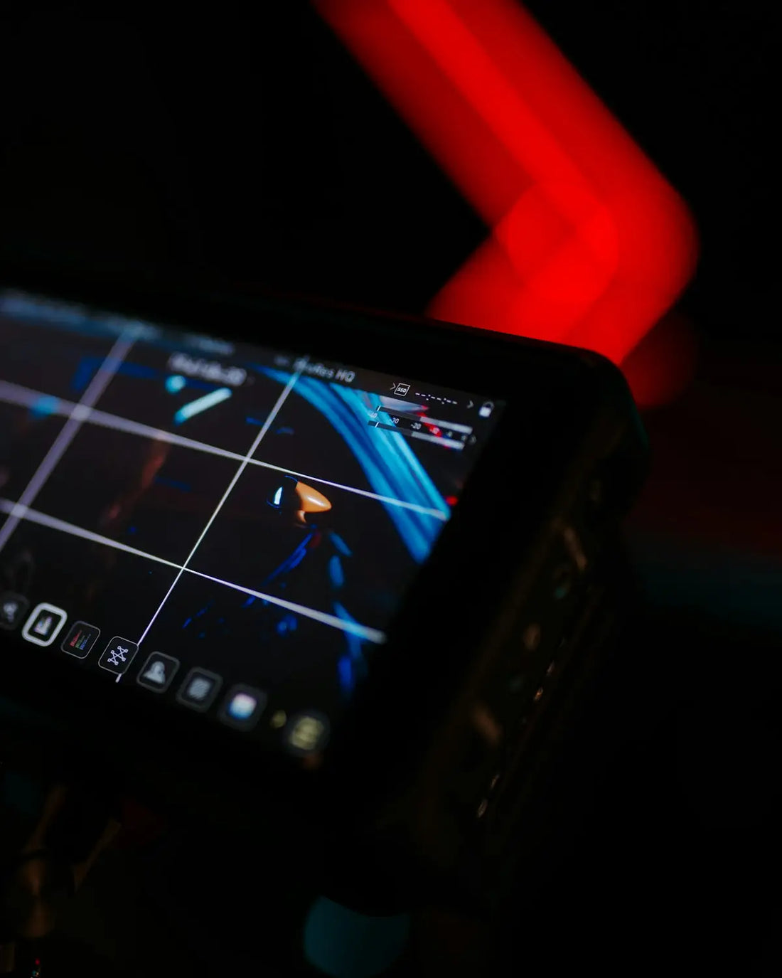 Close-up of a digital screen displaying graphics at night.