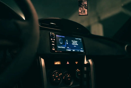 A dashboard of a car with a digital screen