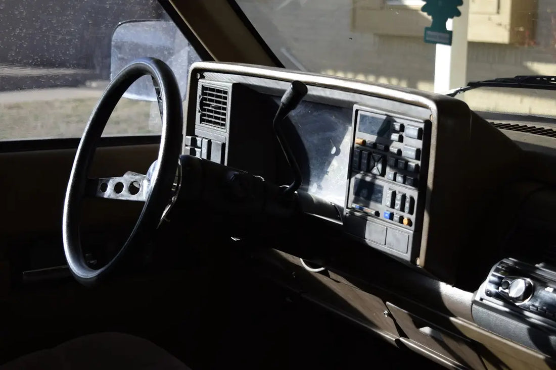 a dashboard of a car with a steering wheel