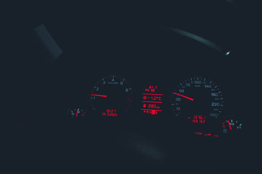 the dashboard of a car at night time