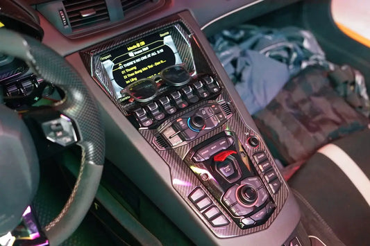 The inside of a car with a steering wheel and dashboard