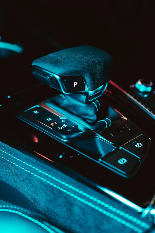 a close up of a car's gear box