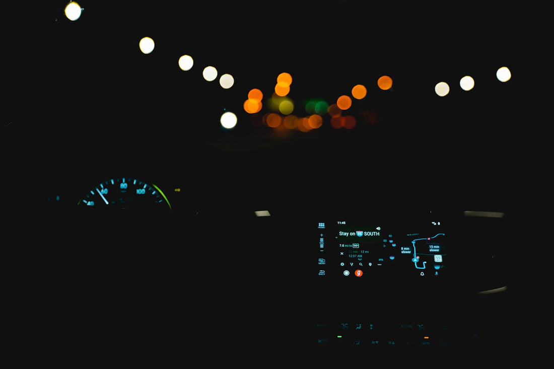 the dashboard of a car at night time