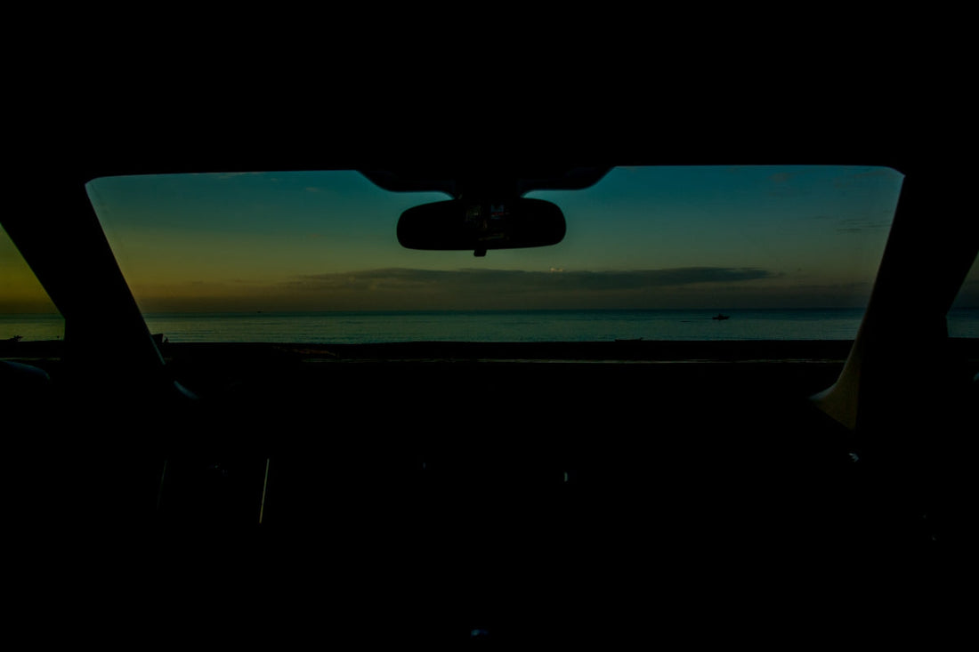 View of the sea from inside a car.
