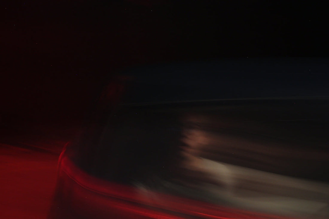 a blurry image of a red and black striped surface