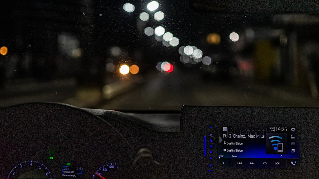 the dashboard of a car at night time