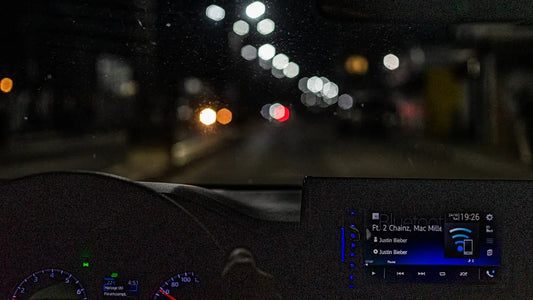 the dashboard of a car at night time