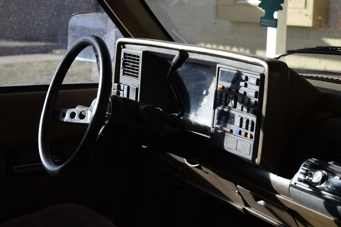 a dashboard of a car with a steering wheel