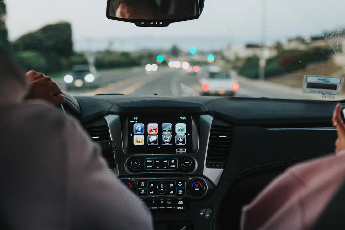 person driving car on road during daytime