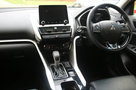 the interior of a car with a steering wheel and dashboard