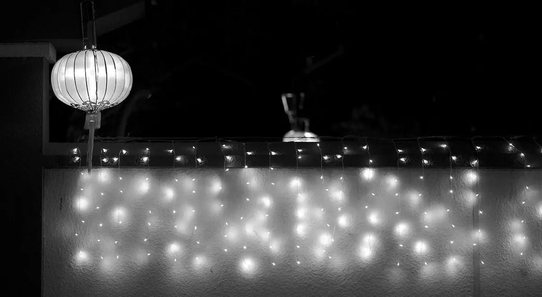 a black and white photo of lights on a wall