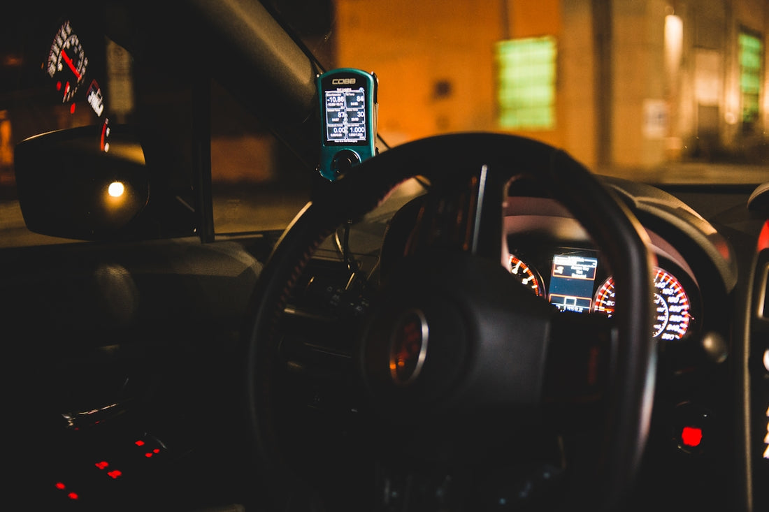 black steering wheel in close up photography