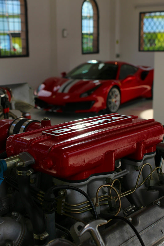 red car in a parking lot