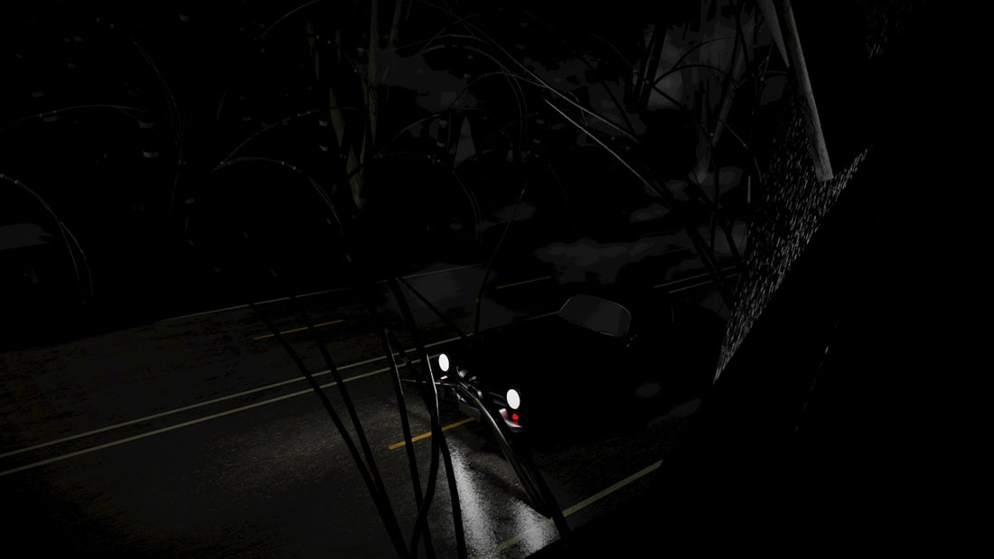 A car driving down a dark street at night
