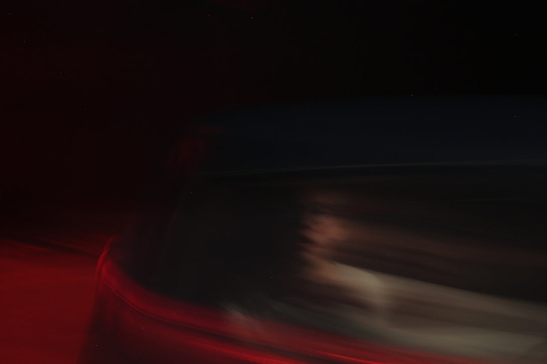 a blurry image of a red and black striped surface