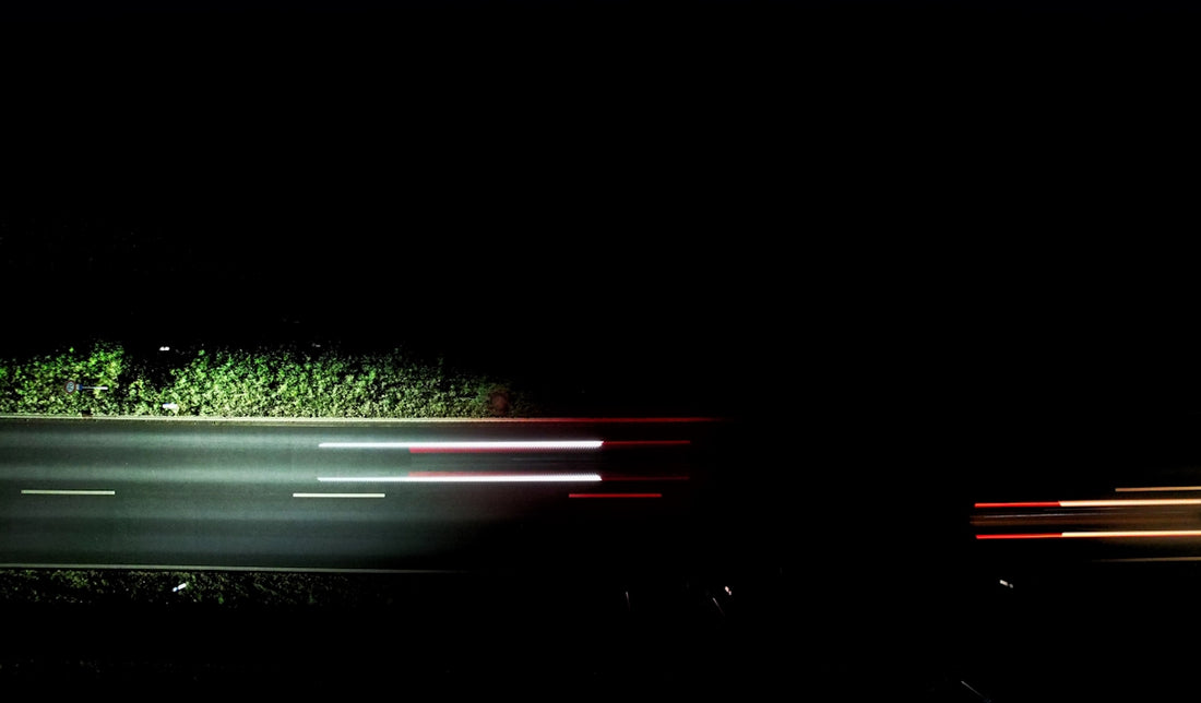 a blurry photo of a street at night