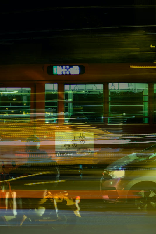 a blurry photo of a city street at night