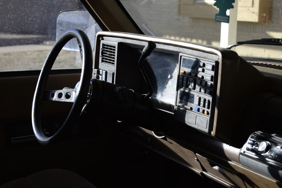 a dashboard of a car with a steering wheel