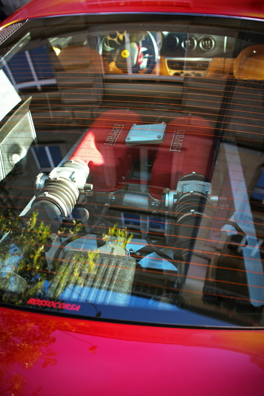 a red car parked in front of a building