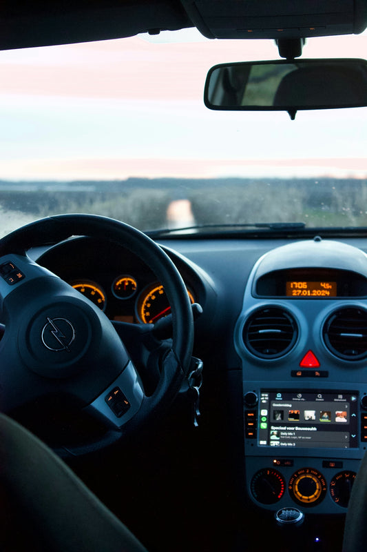 the dashboard of a car with a dash light on