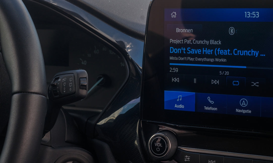A close up of a car dashboard with an electronic device