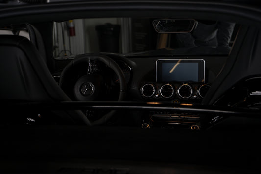 The dashboard of a car in the dark
