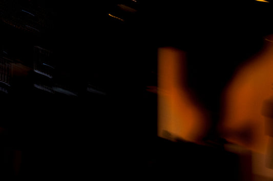 A blurry photo of a clock tower at night