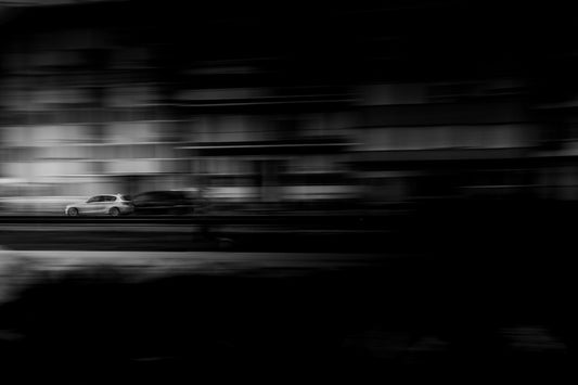 A black and white photo of a traffic light