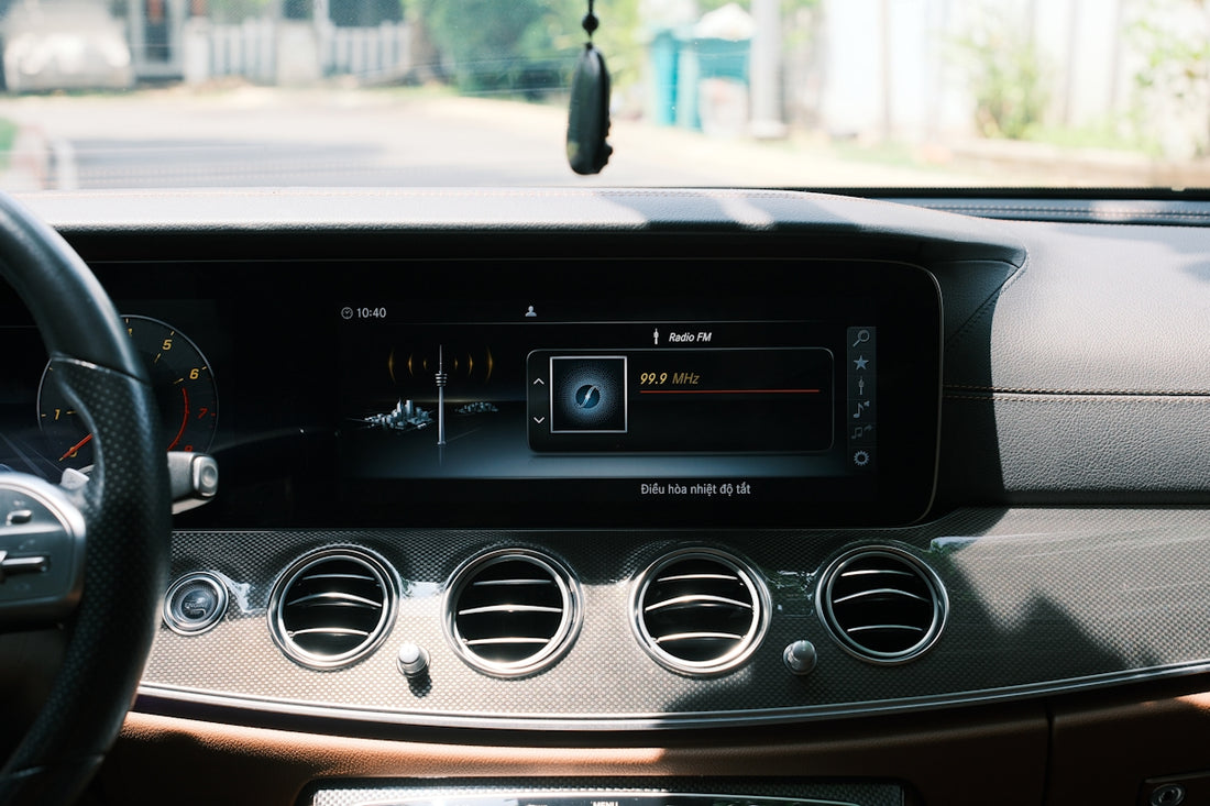 Car interior dashboard with a radio display.