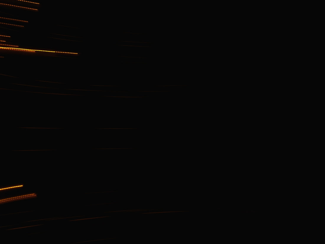 Streaks of light against a dark background