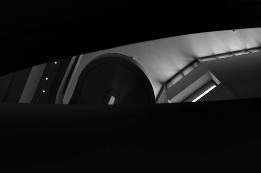 Black and white abstract view of a circular object.