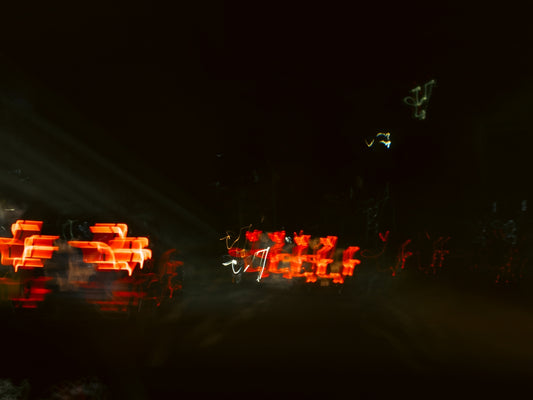 Abstract streaks of red light at night