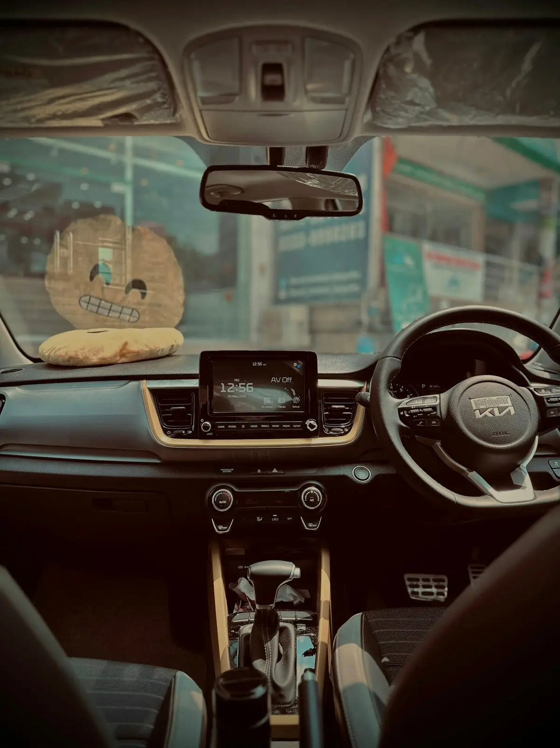 a car dashboard with a steering wheel and a radio
