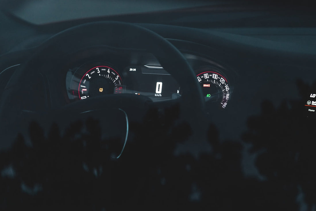 the dashboard of a car at night time