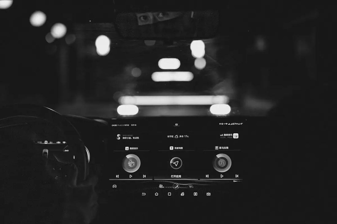 A black and white photo of a car dashboard