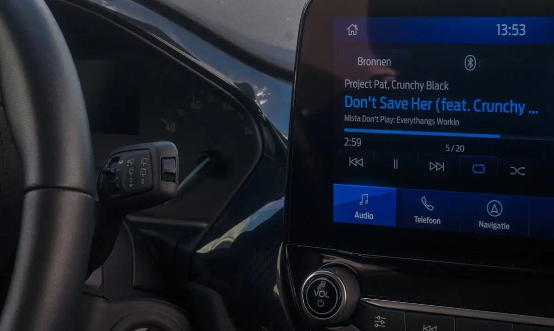 A close up of a car dashboard with an electronic device