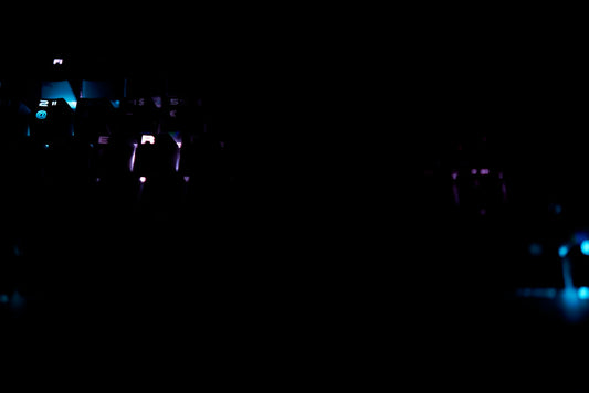 people standing on stage with lights