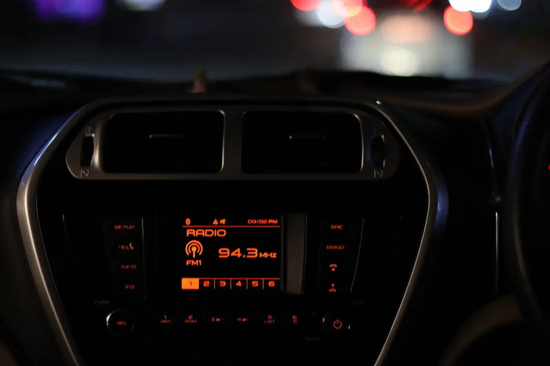 The dashboard of a car at night time