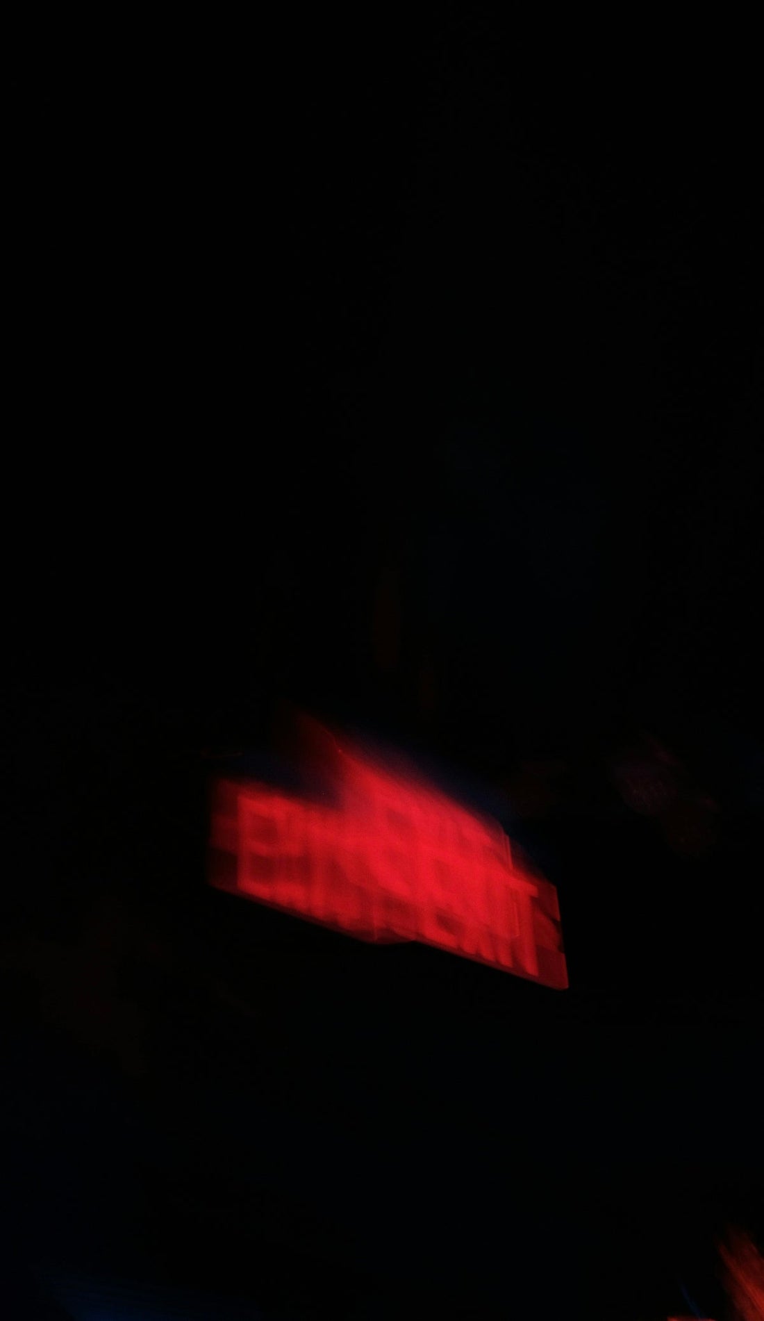 a blurry photo of a building in the dark