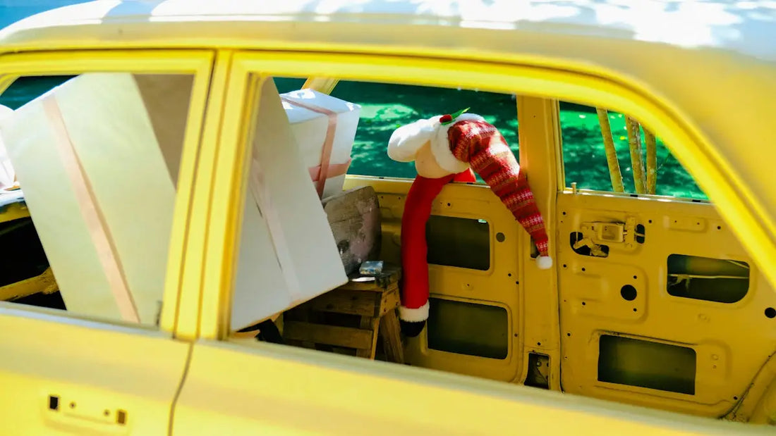 a yellow car with a stuffed animal in the passenger seat