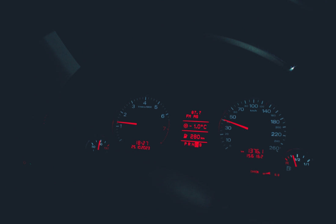 the dashboard of a car at night time