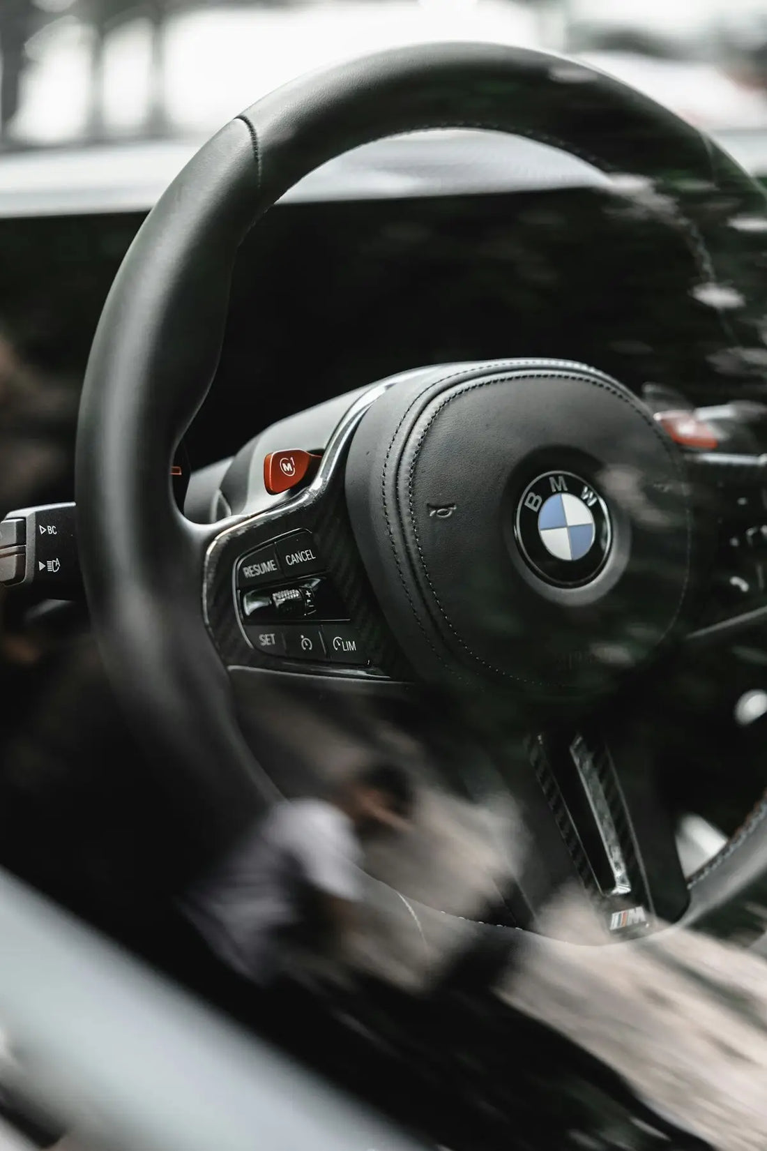 a close up of a steering wheel and dashboard of a car
