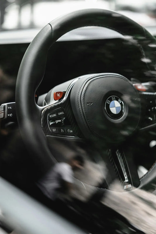 a close up of a steering wheel and dashboard of a car
