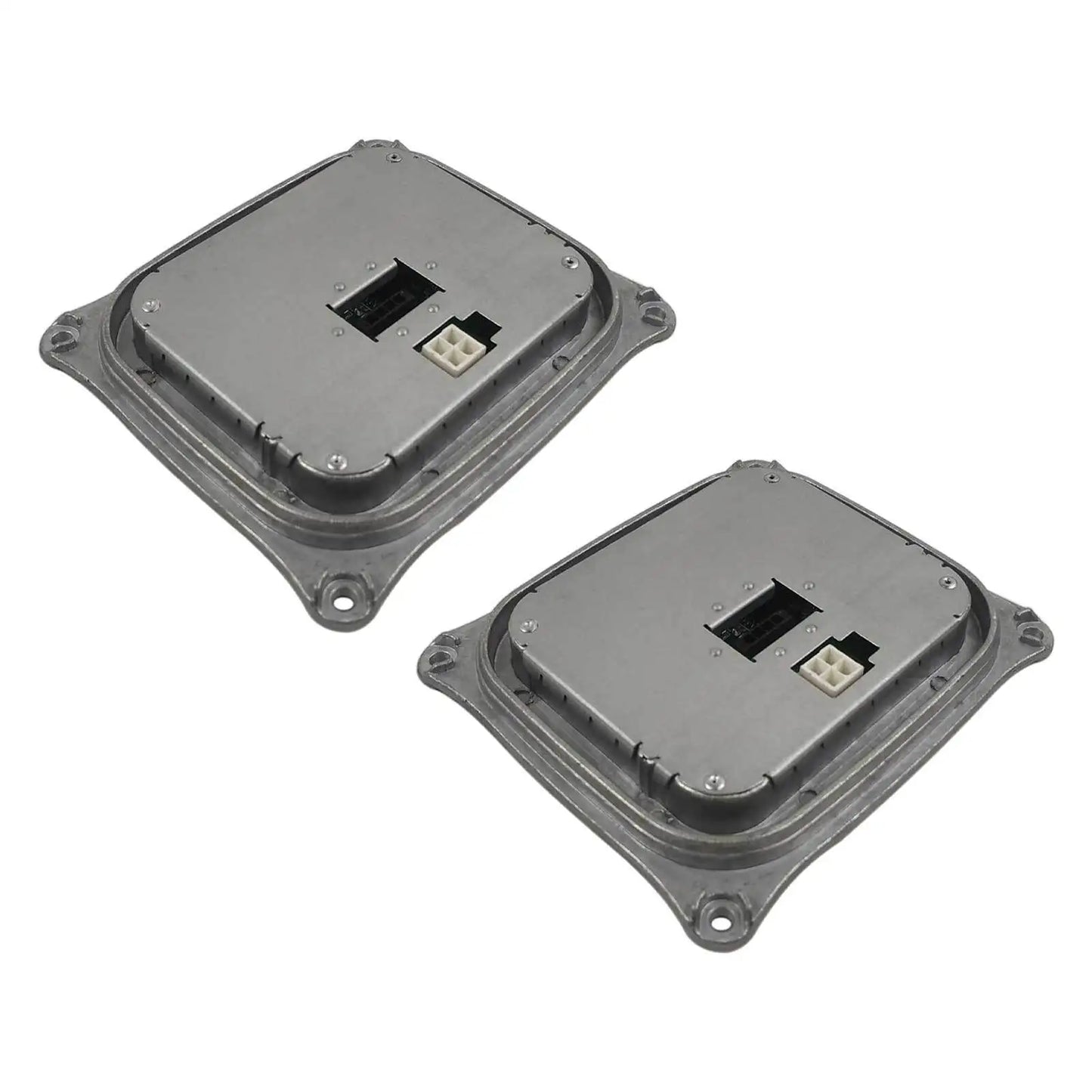 Dwa szare metalowe moduły sterowania reflektora z wbudowanymi złączami do bmw e90 e92 e93 i mini cooper