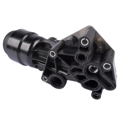 Czarna plastikowa obudowa filtra oleju alfa romeo mito i fiat panda z wieloma gwintowanymi portami i cylindrycznym wlotem