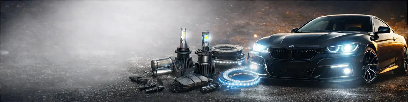 Czarny samochód BMW z oświetlonymi reflektorami i otaczającymi go elementami oświetlenia samochodowego